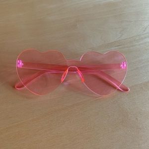 Pink heart shaped plastic sunglasses.